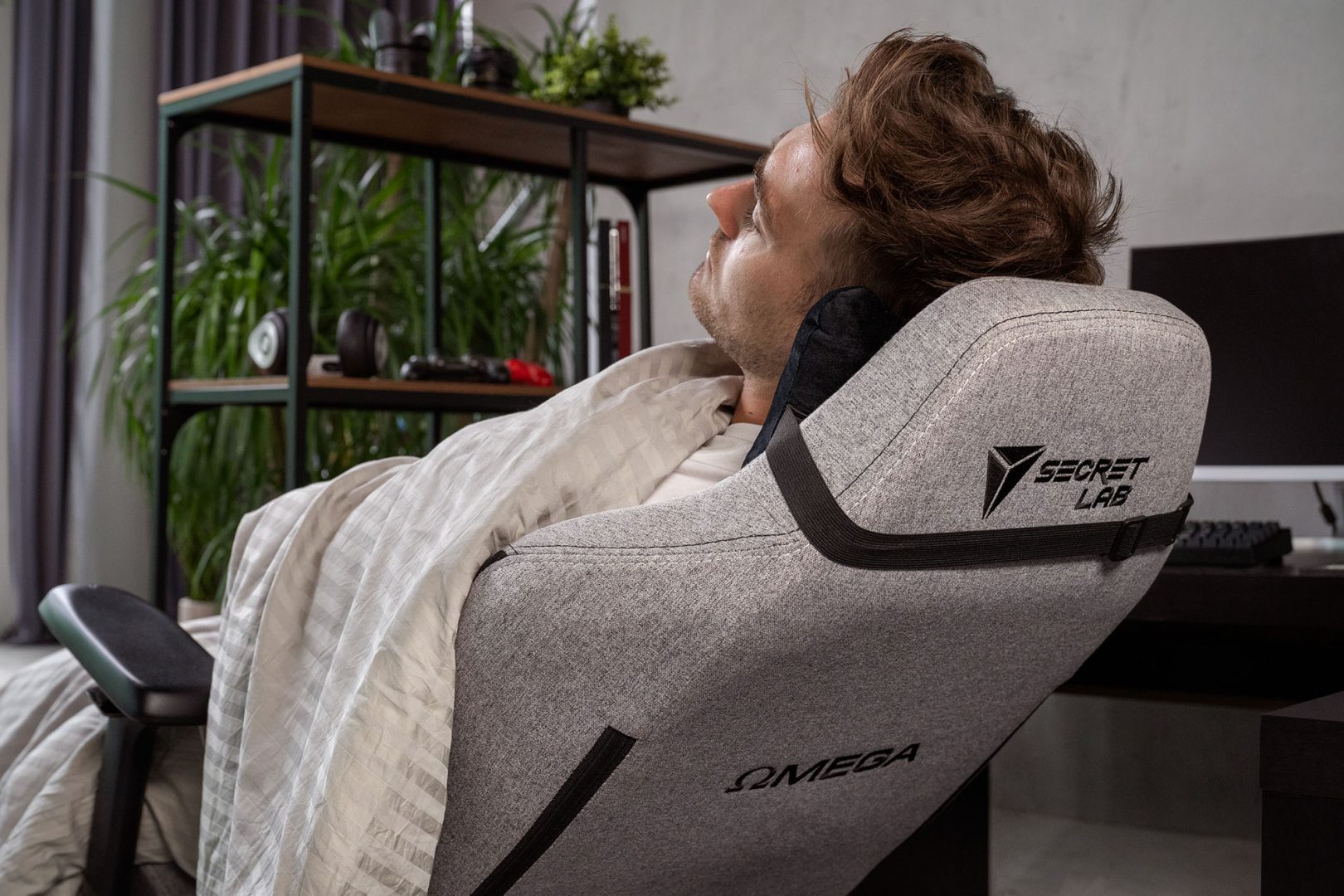 Man taking a nap in an ergonomic PC gaming chair, gaming chair, gaming chairs, gaming seat, gaming seats, ergonomic chair