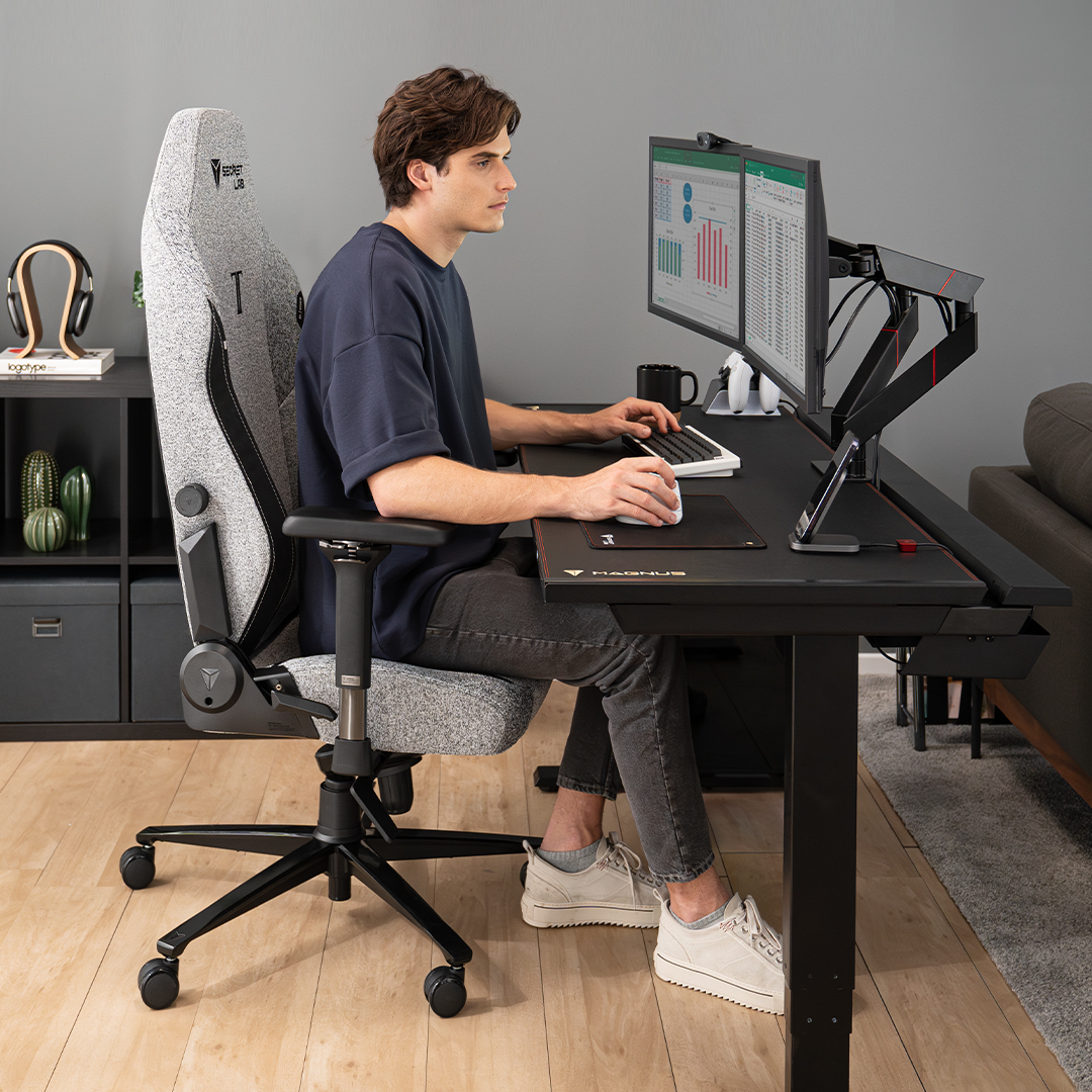 Improve posture by sitting upright on the Secretlab TITAN Evo ergonomic chair, both feet on the floor